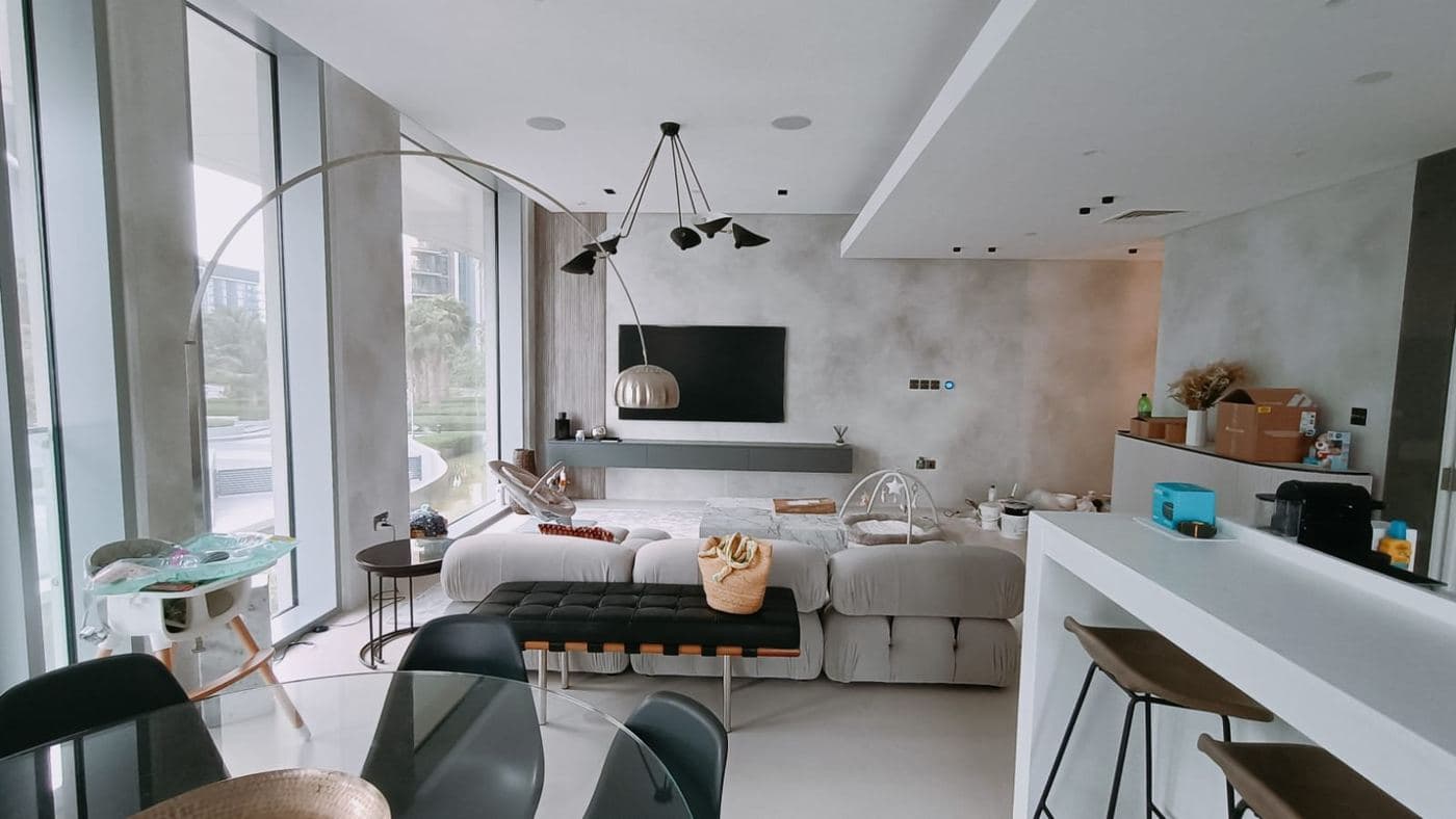 Open-plan apartment living room with floor-to-ceiling windows