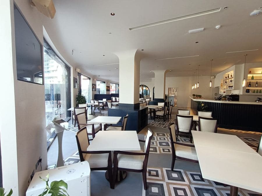 Café dining area with a large woven pendant light